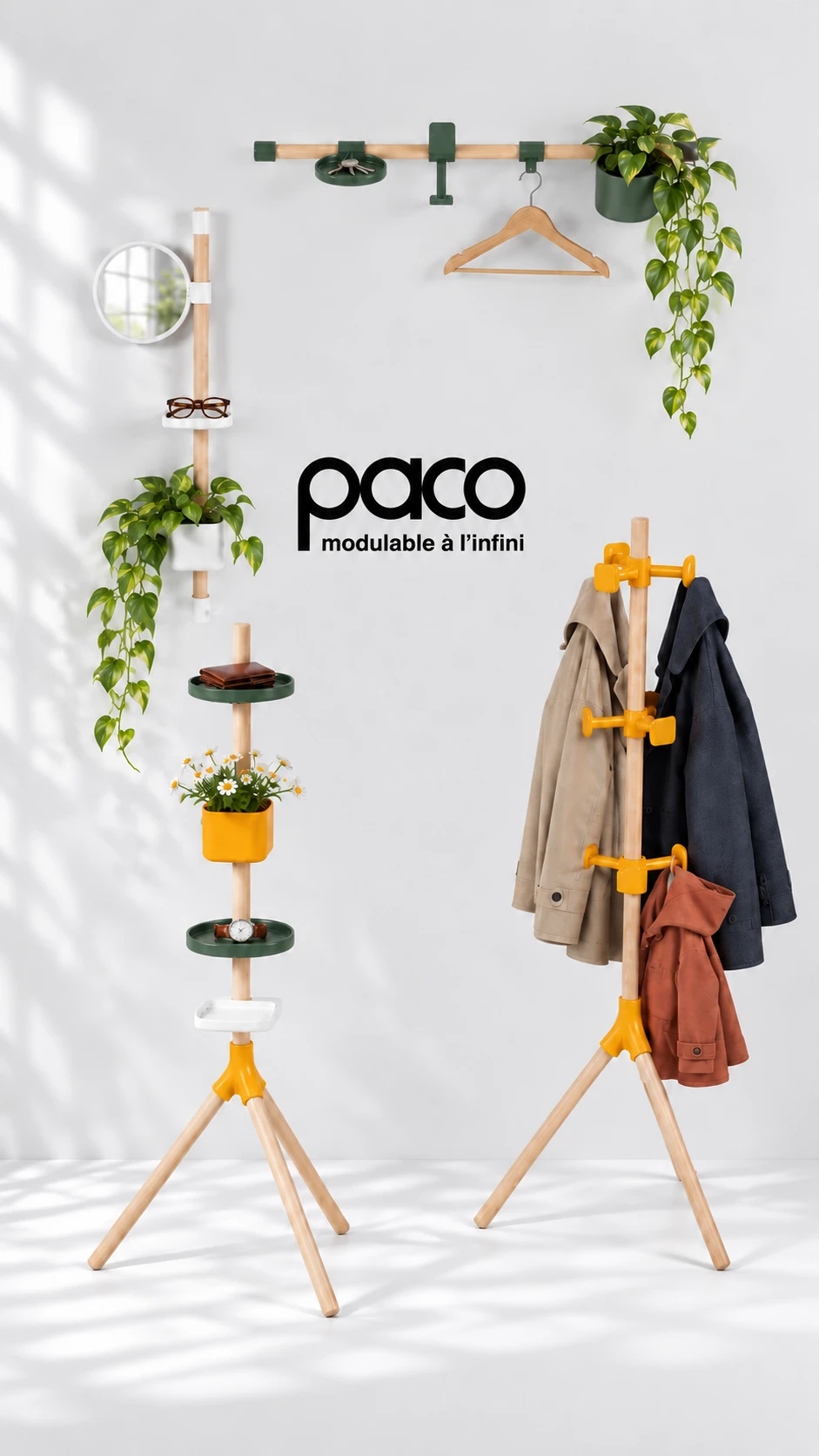 Paco, modulable à l'infini : un porte-plateaux, une barre murale avec miroir et plante, une barre horizontale et un porte-manteau, posés devant un mur clair